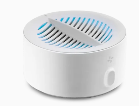PuriBreeze produce cleaner sitting in a bowl of water with fruits and vegetables